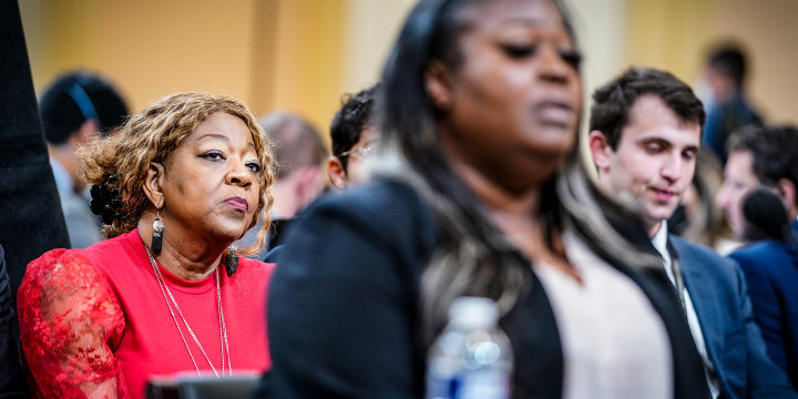 Former Georgia election worker Wandrea ArShaye Shaye Moss, foreground, is seen along with her mother Ruby Freeman in red dress, as the House Jan. 6 select committee holds its fourth public hearing on Capitol Hill on June 21, 2022.